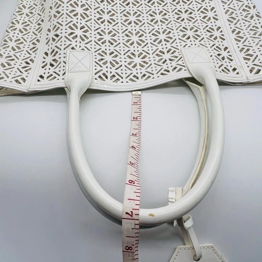 Tory Burch white geometric laser cut out tote bag